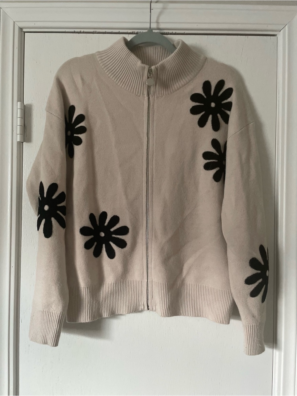 Sioni Cream Zip-Front Sweater with Black Floral Appliqué